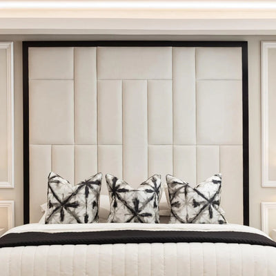 The Grosvenor Abstract Panel Bed in Cream Velvet with Black Edge